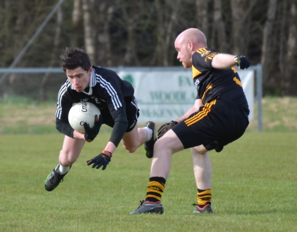 Mickey Gallagher helps St. Enda's Reserves get the defence of their Division One league title off to a flyer at Augher.